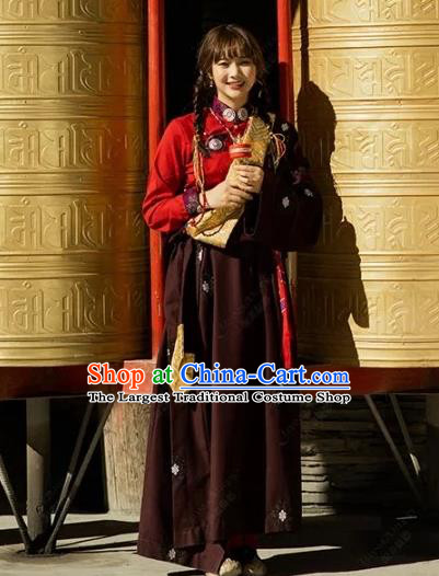China Traditional Xizang Minority Young Lady Wine Red Tibetan Robe Zang Nationality Folk Dance Clothing