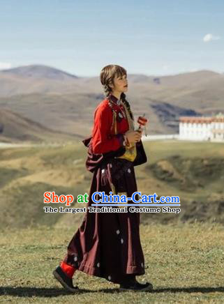 China Traditional Xizang Minority Young Lady Wine Red Tibetan Robe Zang Nationality Folk Dance Clothing