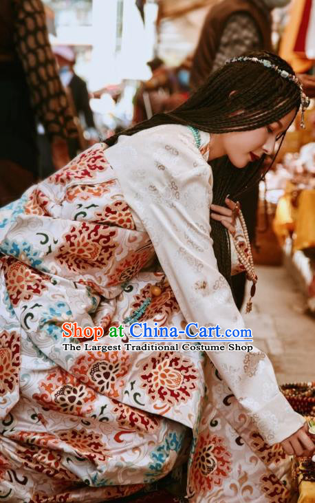 China Traditional Xizang Tibetan Minority Young Lady Clothing Zang Nationality Folk Dance Beige Brocade Robe